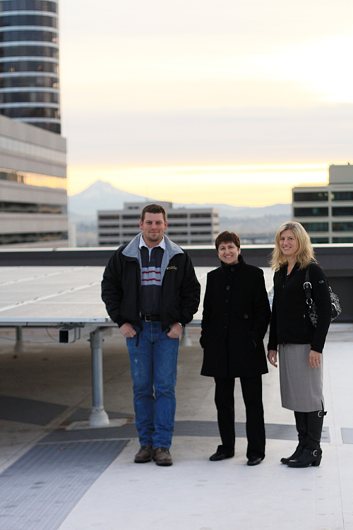 From left to right: Troy Boardman, Barbara Sestak and Joanna Evenson strike a pose next to Lincoln Hall’s newly installed solar panels.