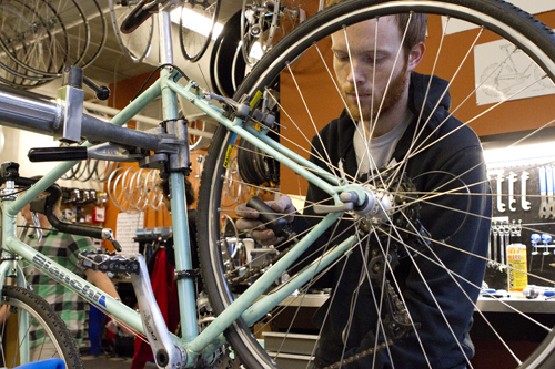 Maintaining a trend: Pete Swallen, a mechanic/instructor at the PSU Bike Hub, works on a bike.