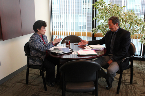 Monica Rimai (left) and Roy Koch discuss issues in their bimonthly meeting.