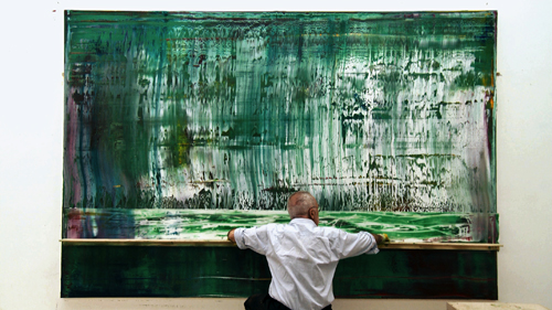 Artist at work: Gerhard Richter imposes order on the chaos of his canvas.